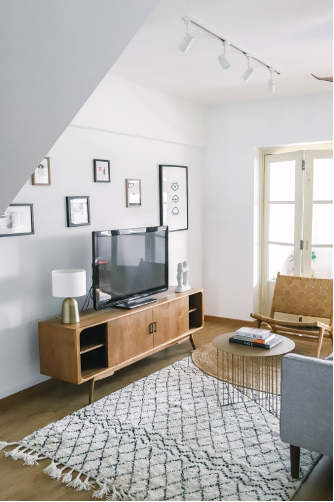 Scandinavian living room with Tv console and lounge chair