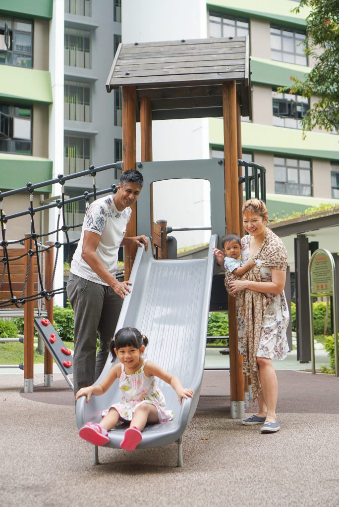 Sarah and her family at the playground at Tampines GreenRidges