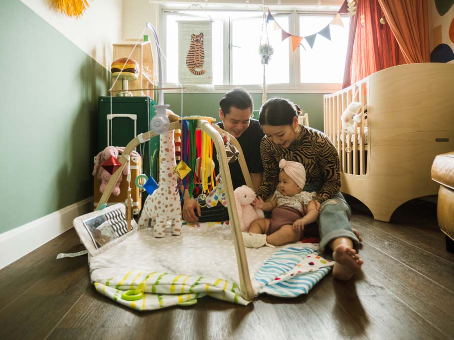 Kenneth Xin Rong and their daughter in the nursery