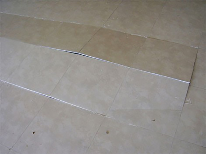 Dislodged and popping tiles