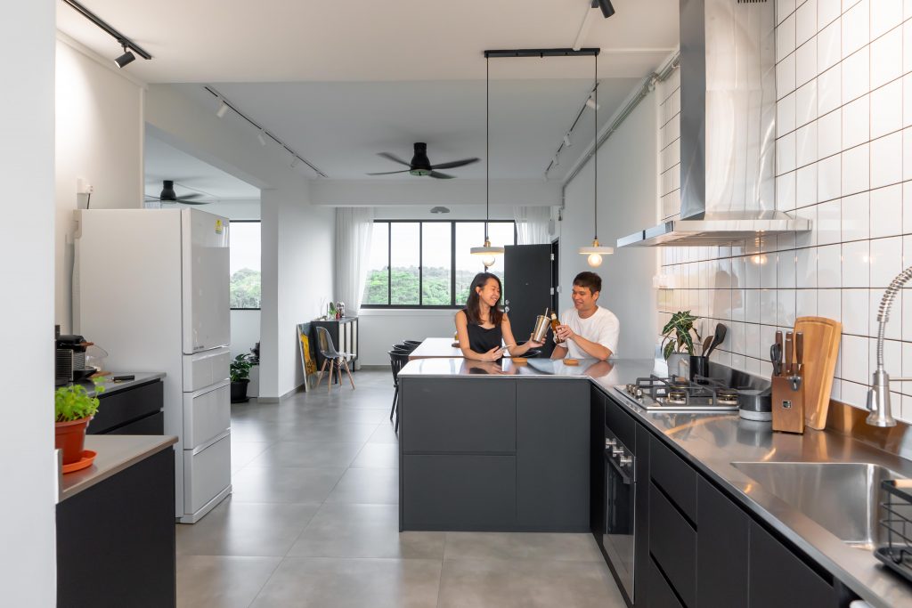 Home owners Shu Xia and jin An in the kitchen of their HDB flat